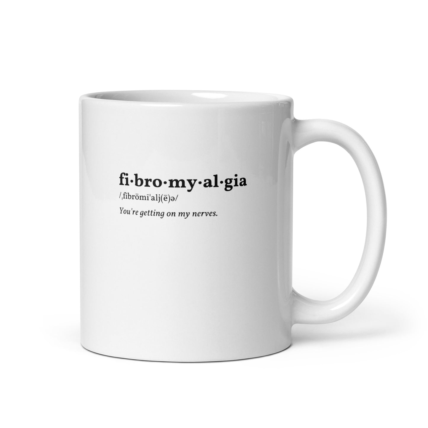 up close image of a white mug that reads "fibromyalgia / you're getting on my nerves"